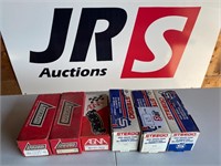 Box of various brake pads for early vehicles