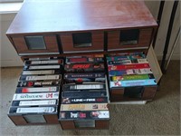 60+ assorted VHS tapes in vintage organizer