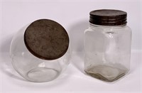 2 store jars: round jar with flat bottom, tin lid,