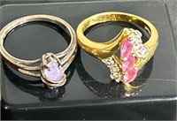 2 rings -1 gold  colored, stones may