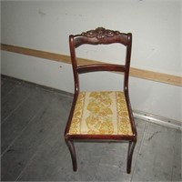 Nice mahogany dining chair. Rose on top.