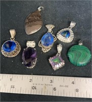 Group of stone and gemstone pendants some pieces