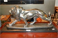 Statue of a prowling lion, silver gilt