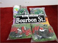 Mardi Gras beads, string lights(peppers)