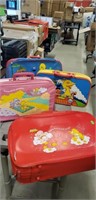 Lot of Kids suitcases,2 Sesame street and 2 Care