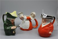 Three Royal Bayreuth pitchers including man with l