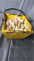 Yellow wooden bucket with corks