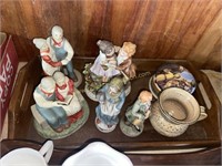 Figurines in wood tray