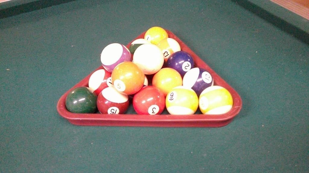 pool cues, rack, balls