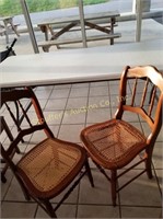 Two cane bottom chairs