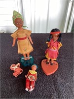 G)  lot of four 1960s native American dolls