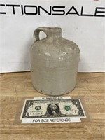Small stoneware jug has crack