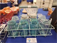 EIGHT BLUE CANNING JARS WITH WIRE MILK CRATE