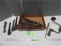 Wood auger bits, pipe wrenches, screw driver, hand