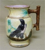 Large Majolica Bird Pitcher with Bamboo Handle.