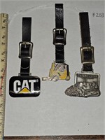 Three vintage Caterpillar tractor fobs Cat