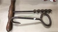 Antique iron hay hook & hole driller with wood