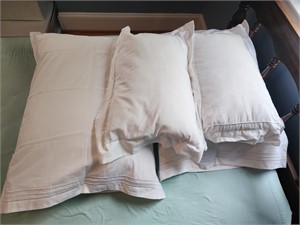 Two standard pillows with white cases, 2 white