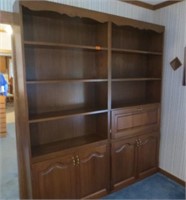 2 bookcases one with drawer and desk area