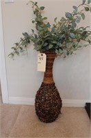 Plant with wicker vase