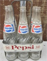 Vintage metal Pepsi holder with glass bottles