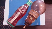 Metal Coca-Cola bottle thermometer and a