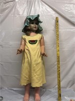 Life-size Doll w/yellow dress & green hat
