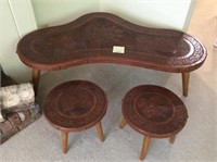 Carved wooden table and stools