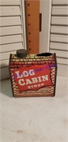 Log cabin syrup tin can