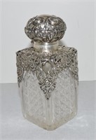 Cologne bottle with silver top with hallmarks,