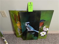 2 painted bird cavases