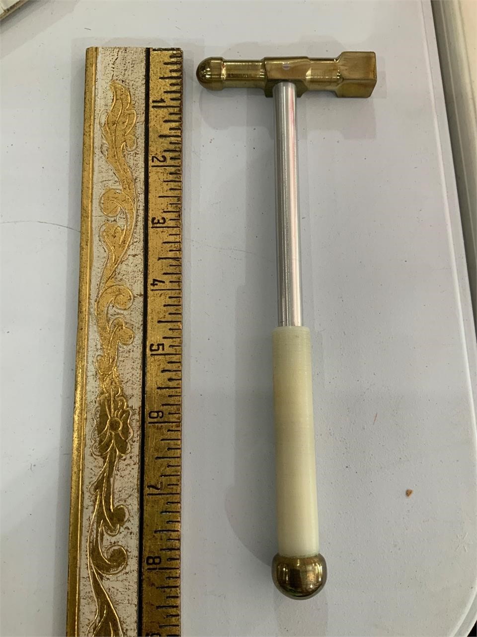 small hammer with brass head
