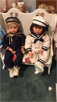 2 sailors dolls on bench