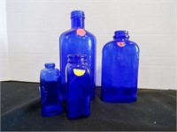 4 vintage cobalt blue glass bottles