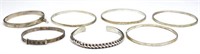 A group of seven silver bangles