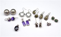 A group of various silver earrings