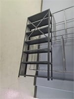 Metal shelving unit located upstairs