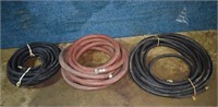 3 lengths of rubber 1" & 1.5" water hose; as is