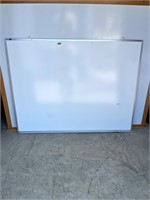 Dry erase board in metal frame