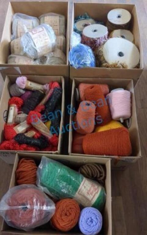 Five boxes of wool different weights and colors