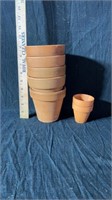 7 small clay flower pots