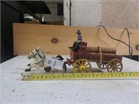 Cast iron horses and wagon with log