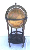 Old world-style wood globe rolling bar cart