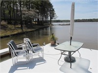 PATIO TABLE W/ 4 CHAIRS AND 8' UMBRELLA ON DOCK