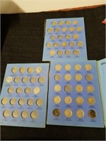 Collection of Buffalo nickels inside damaged book