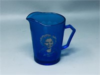 Blue glass creamer w/ Shirley Temple