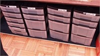 Four plastic storage cabinets, three with four