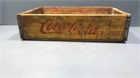 vintage yellow wooden coca cola crate