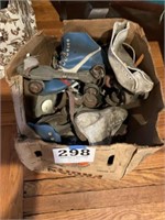 Box of old roller skates
