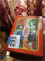 Sewing items in a 
Thomas and friends metal box